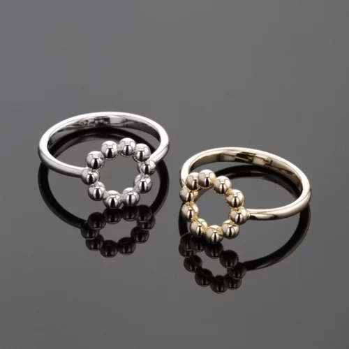 Yellow and white gold rings with balls