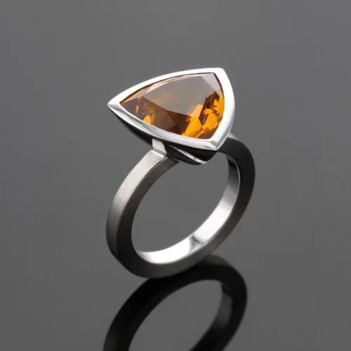 White gold ring with a trillion shaped Citrine