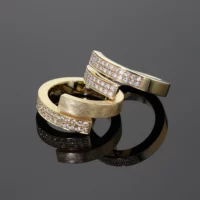 Chunky rings in a brushed yellow gold with diamonds