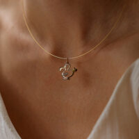 Yellow gold dodo pendant with diamond wings