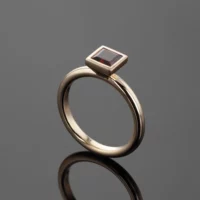 Rose gold ring with a square shaped Garnet