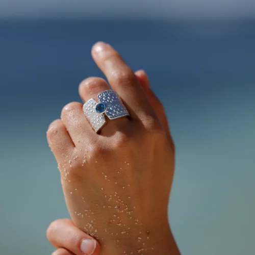 Wide sea urchin ring with a Blue Topas