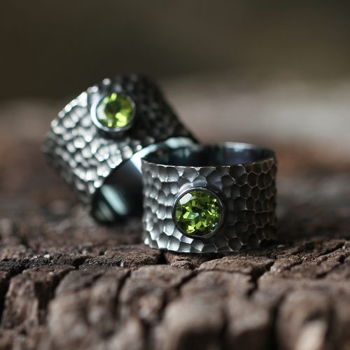 Wide oxidised silver rings with lava texture and Peridots