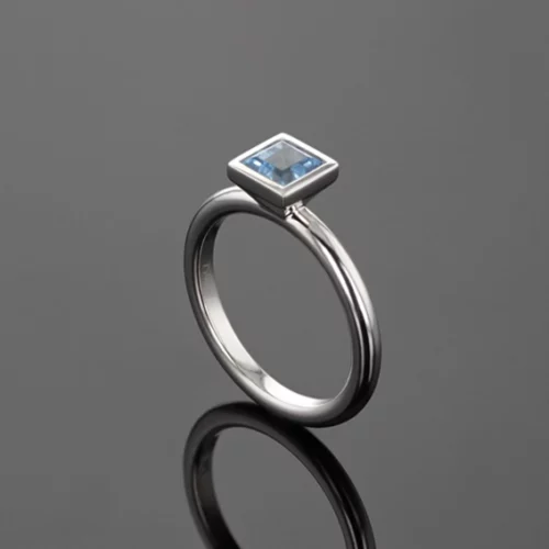 White gold ring with a square shaped Blue Topas