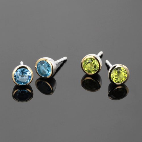 Silver and gold earrings with peridot and blue topas