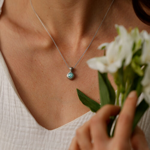 Glowing Paraiba gemstone set in an 18ct white gold pendant