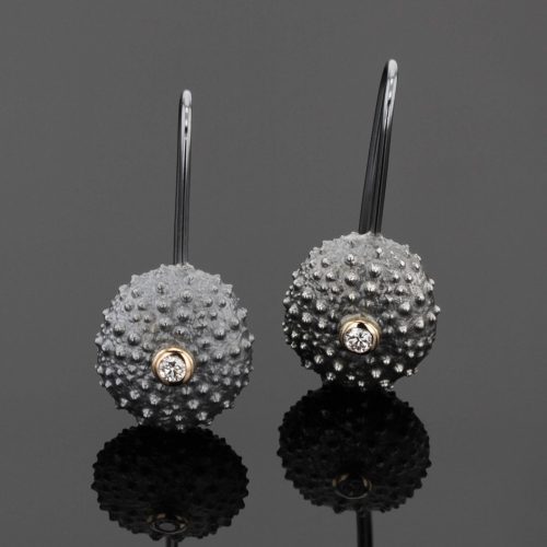 sea urchin earrings in oxidized silver with diamonds set in gold