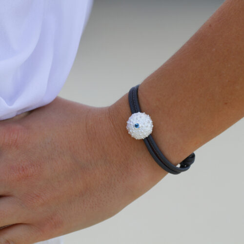 Sea urchin in silver with a Blue Topas stone on a leather bracelet