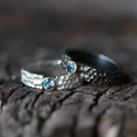 Sterling silver rings with lava rock texture, Blue Topas stones and gold settings