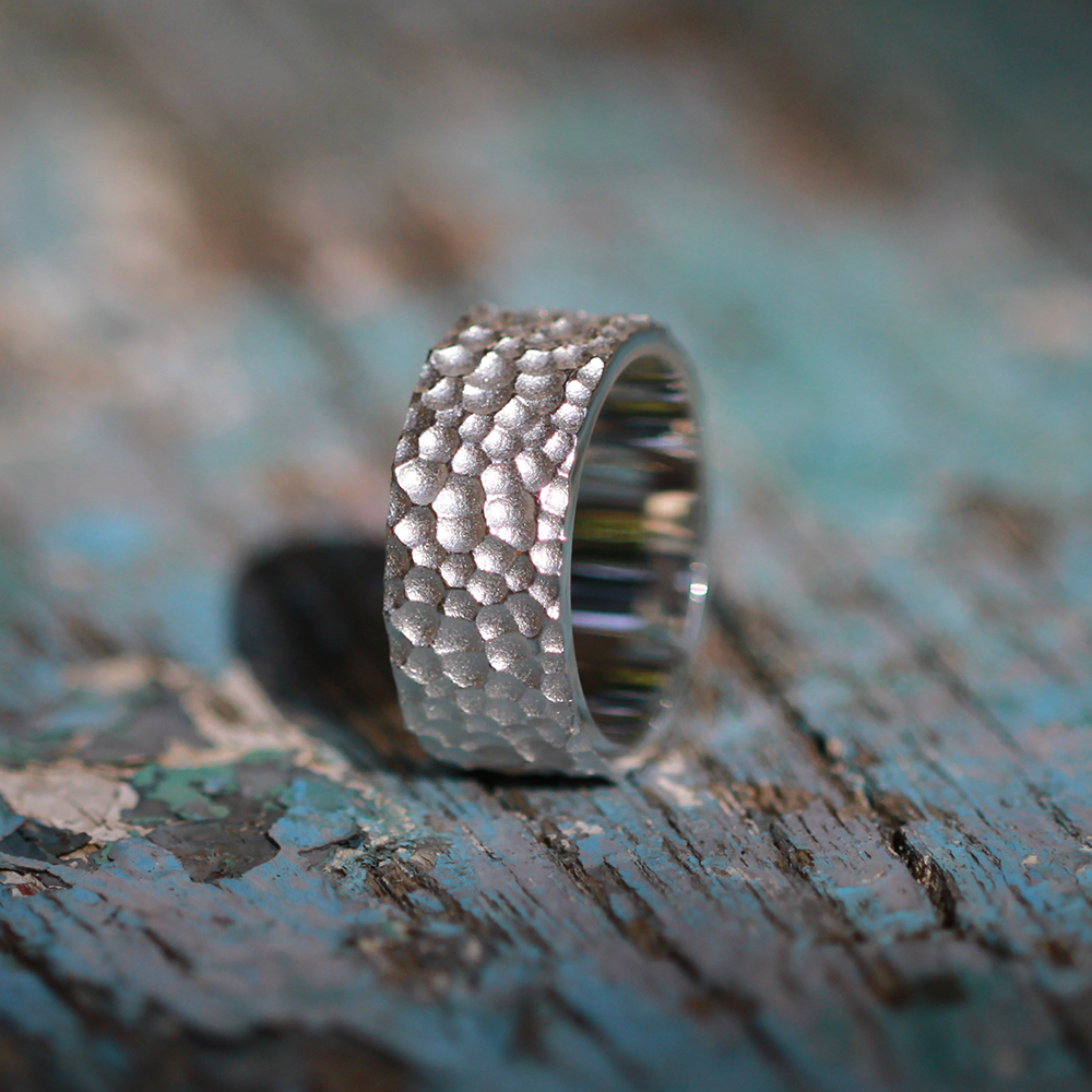 Silver ring with lava texture