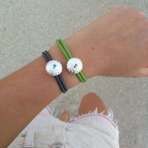 Sea urchin elements in silver with precious stones (Blue and green) on leather bracelets