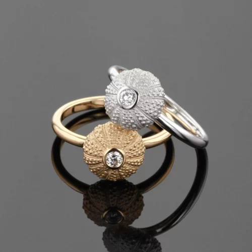 Delicate and small sea urchin rings in white and rose gold with diamonds