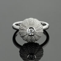 Delicate sea urchin ring in 18ct white gold with a diamond