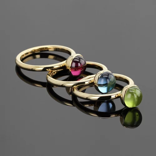 Yellow gold rings with Peridot, Blue Topas and Rhodolite cabochons