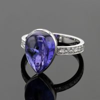 Tear shaped Tanzanite set in an 18ct white gold ring with diamonds on the shank