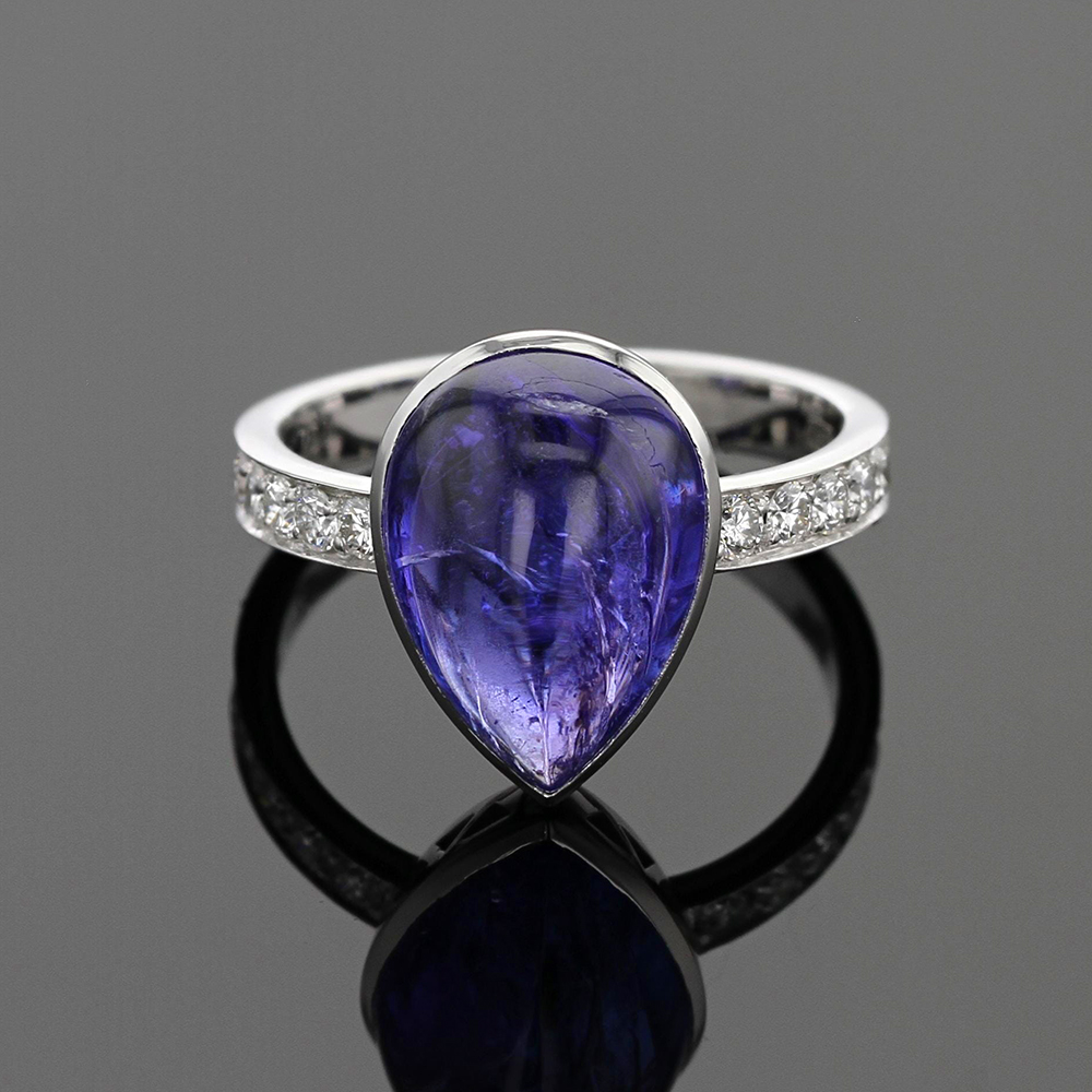 Tear shaped Tanzanite set in an 18ct white gold ring with diamonds on the shank