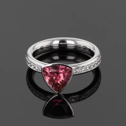 18ct white gold ring with diamonds on the side and a triangular shaped Pink Tourmaline