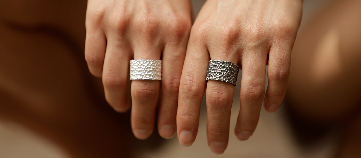 Lava rock textured couple rings in oxidised and natural silver