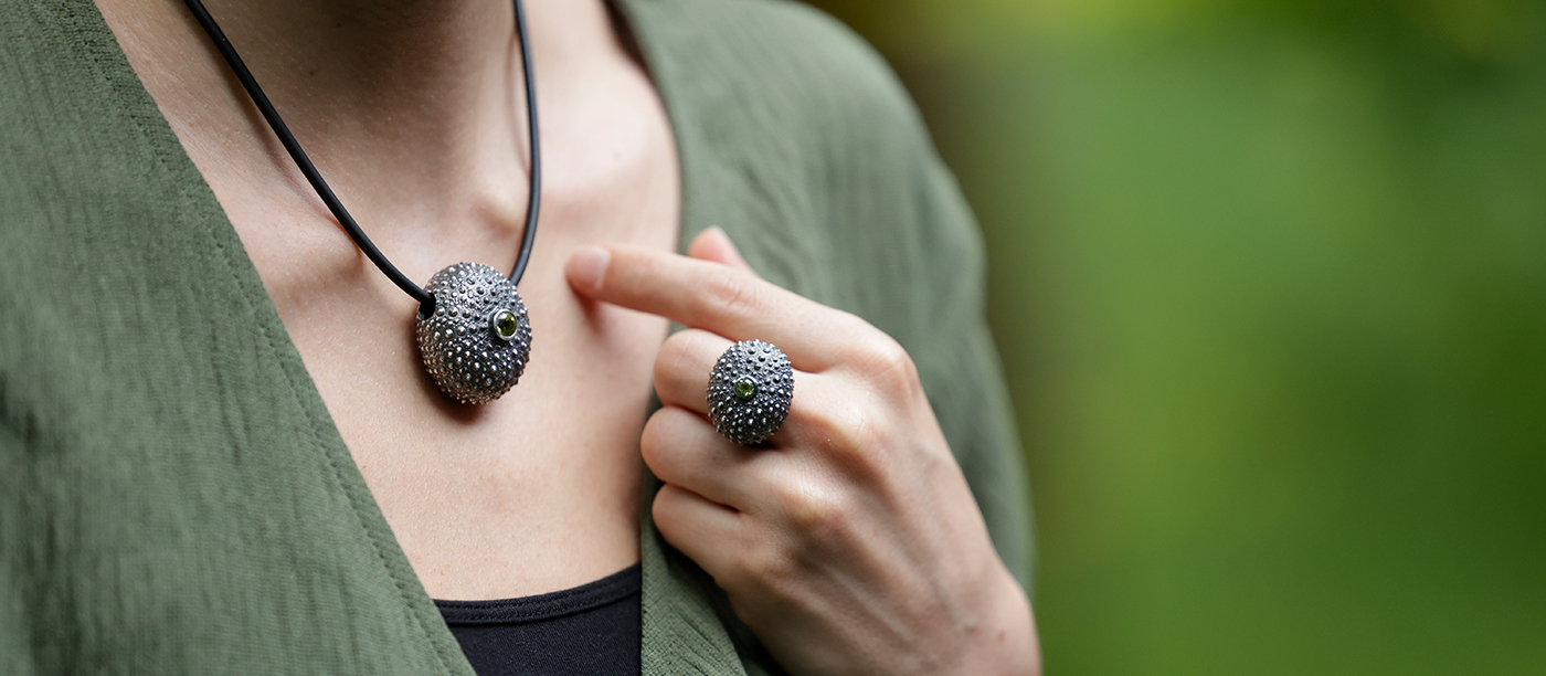 Large sea urchin pendant and ring in black silver with a Peridot stone