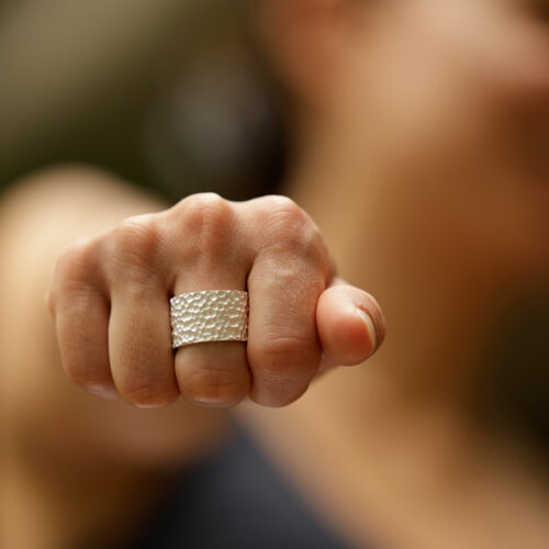 Wide rock textured ring in silver