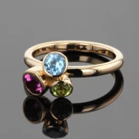 Rose gold ring with a Blue Topas, Peridot and Rhodolite