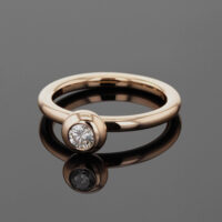 Ring in polished 18ct rose gold with a half carat diamond