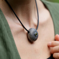 Large sea urchin pendant in oxidised sterling silver with a Peridot gemstone