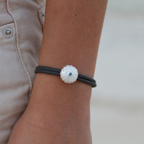 Sea urchin in silver with a Blue Topas stone on a leather bracelet