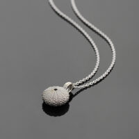 Delicate and small sea urchin pendant in 18ct white gold