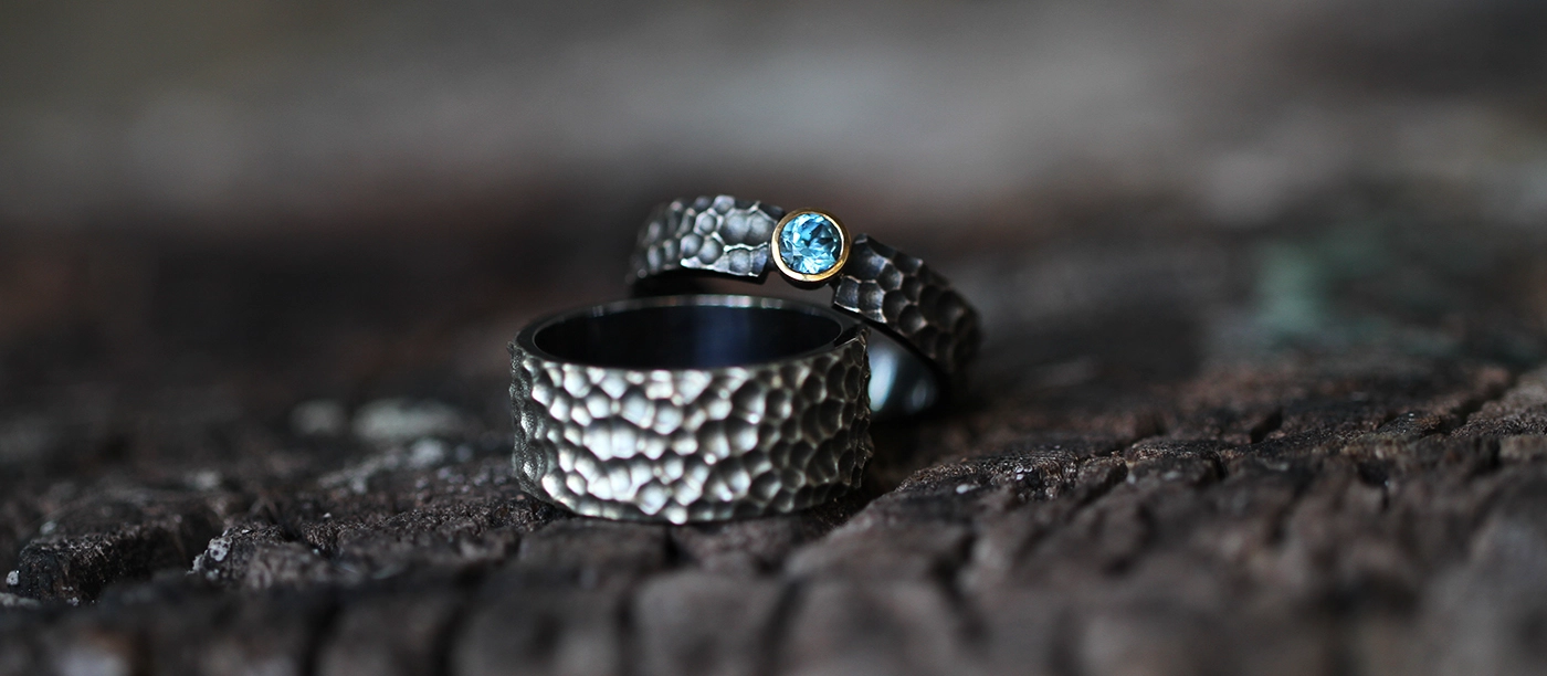 Black silver rings with a lava rock texture