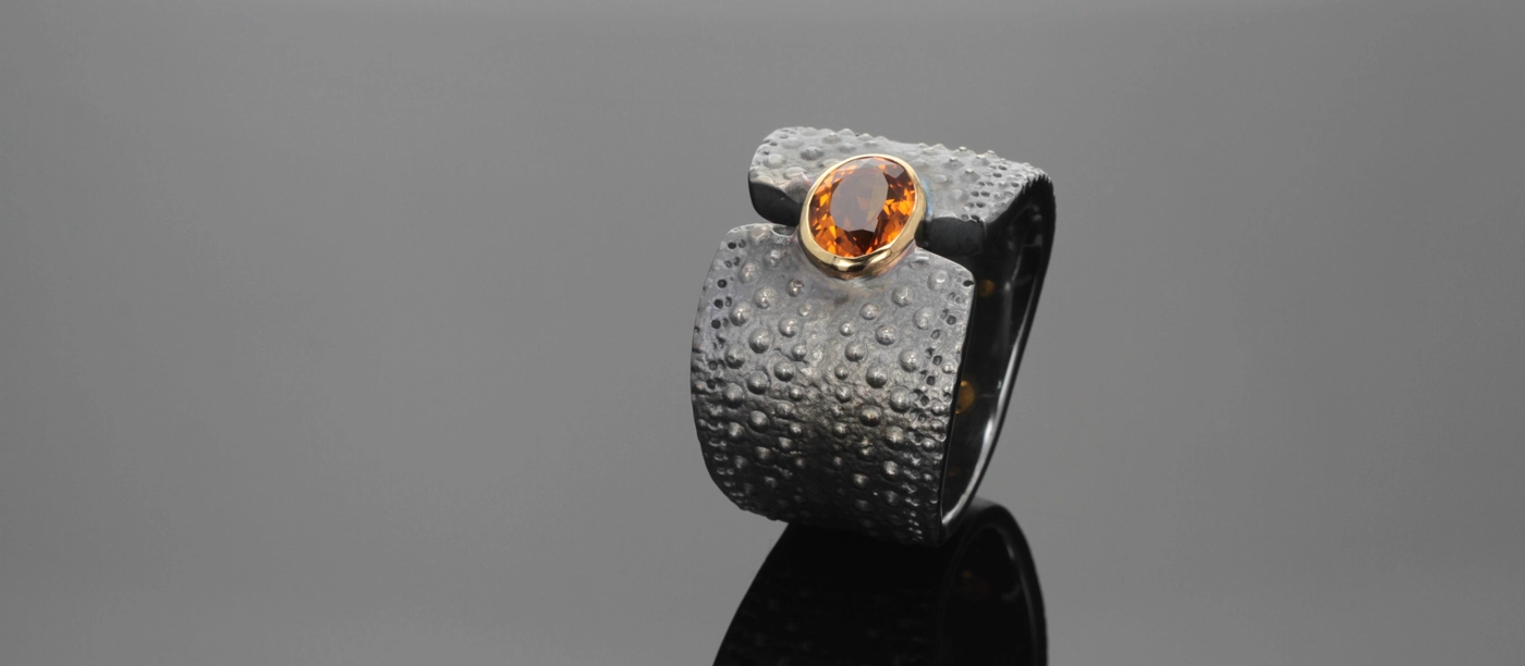 Oxidised silver sea urchin ring with an oval shaped Citrine