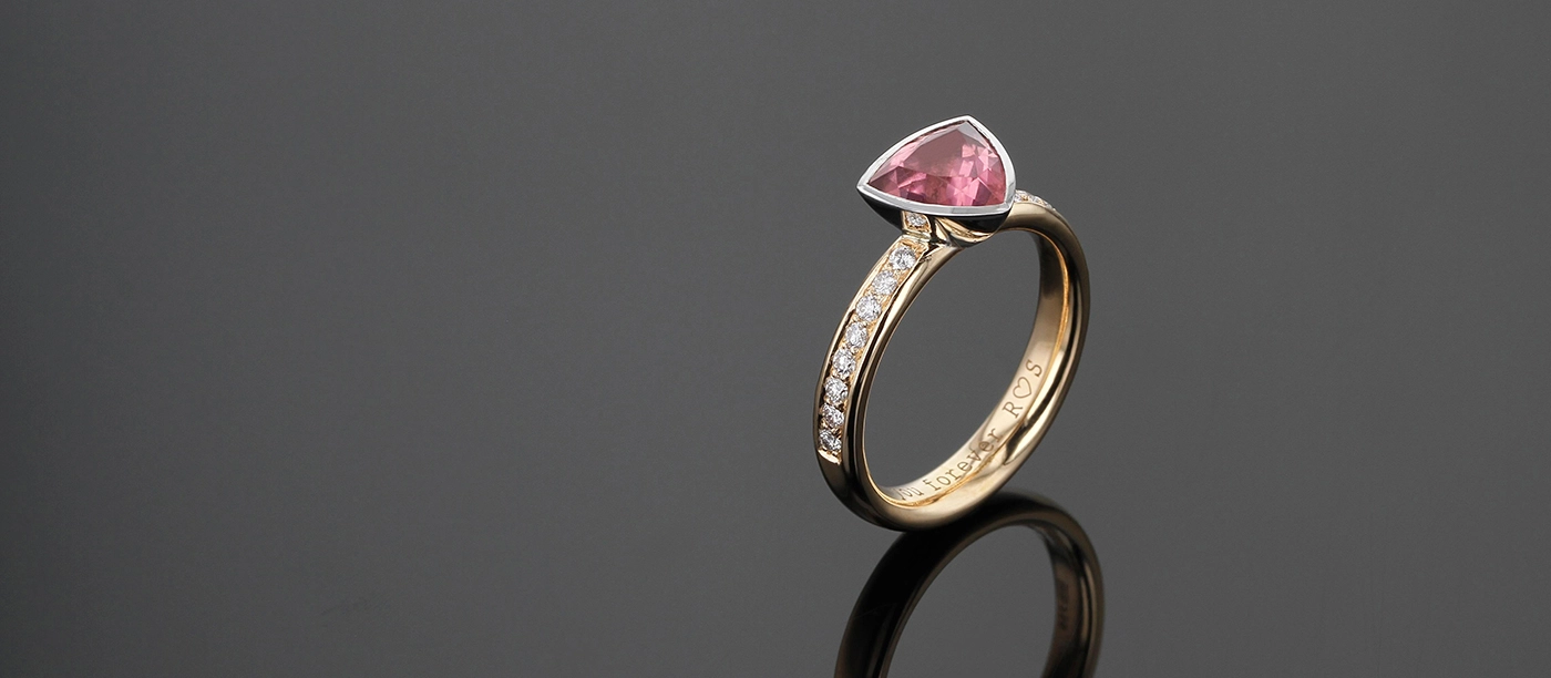 Rose gold ring with a tear shaped green Tourmaline and diamonds