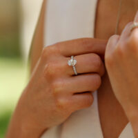 1.55ct oval shaped lab grown diamond ring in white gold with diamonds on the band.