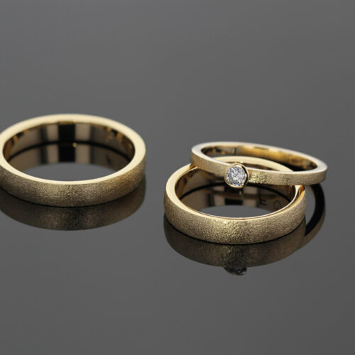 Frosted gold wedding and engagement rings