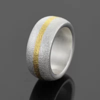 Frosted silver ring with a yellow gold strip