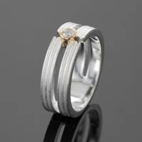 Sterling silver ring with a yellow gold setting and lab grown diamond