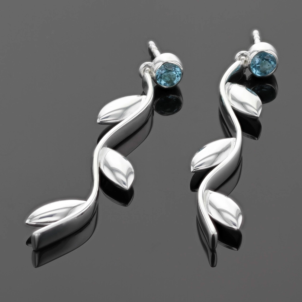 Long dangling earrings in silver with a Blue Topas