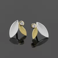 Silver and gold leaf earrings with diamonds