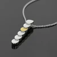 Long pendant in silver and gold