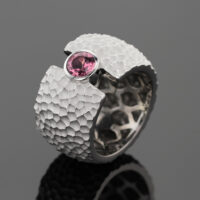 18ct white gold ring with a lava rock texture and Pink Tourmaline