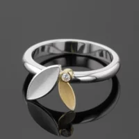 Silver ring with an 18ct gold element and diamond